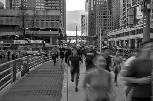 Captured in GTA during a running event on the sidewalk. I used a slow shutter speed to capture the flow of people. 