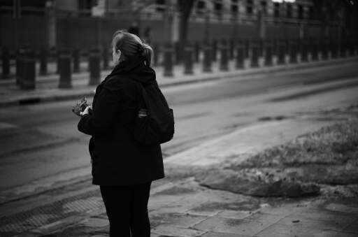 A woman waiting for traffic light 